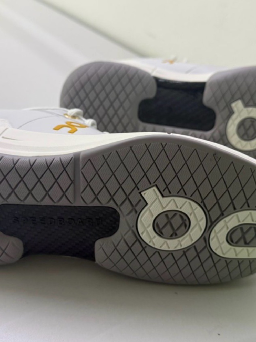 Women's White Sneakers with Gray Soles and Gold Logo Accent